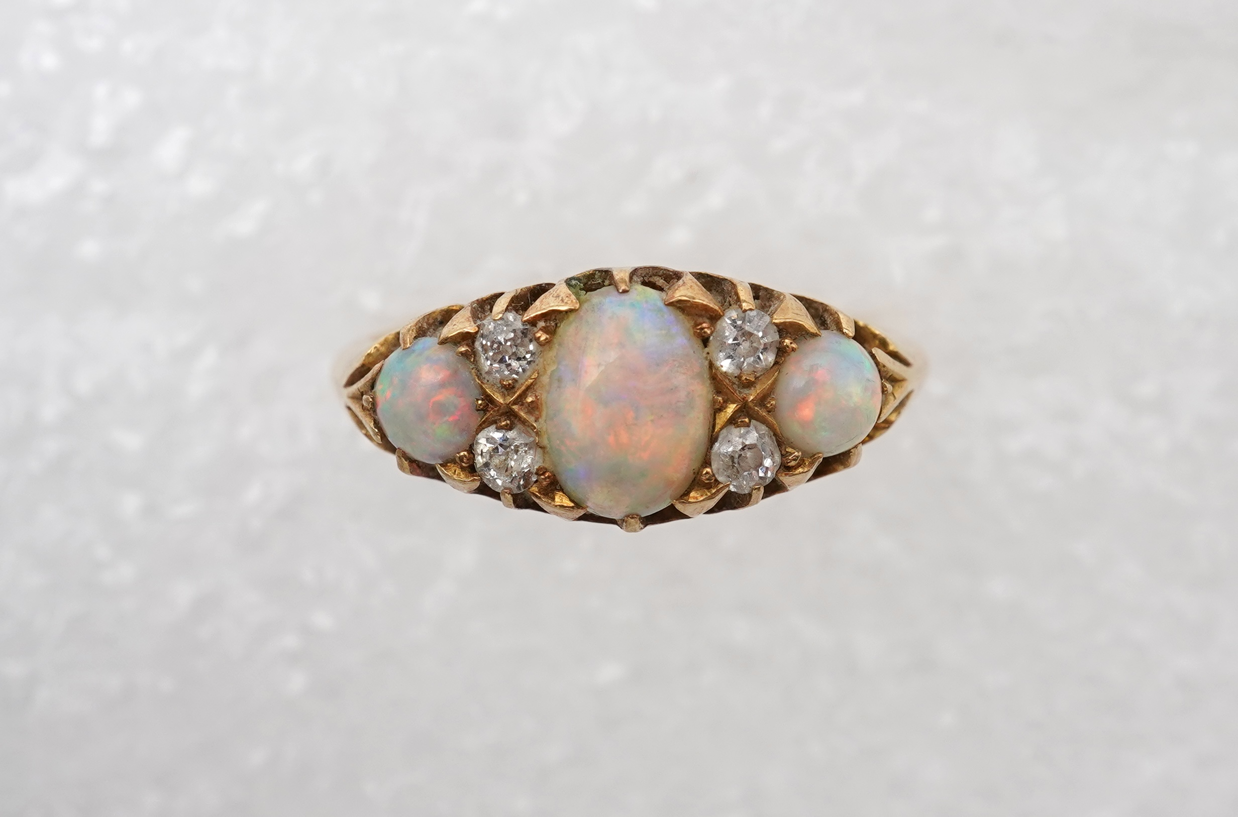 An Edwardian opal and diamond ring, circa 1904